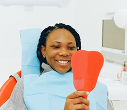 Smiling woman in dentist’s chair