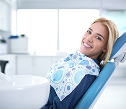 Smiling woman in dentist’s chair