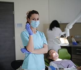 Dental hygienist and woman in dentist’s chair