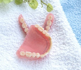 a set of dentures on top of a towel