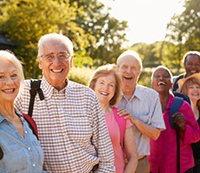 Group of seniors hiking together outside