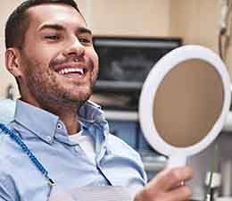Man smiling at the dentist