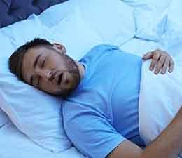 Man sleeping with his mouth open