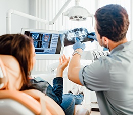 a woman having her teeth cleaned at the dental office