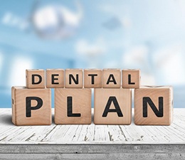 Blocks spell “dental plan”